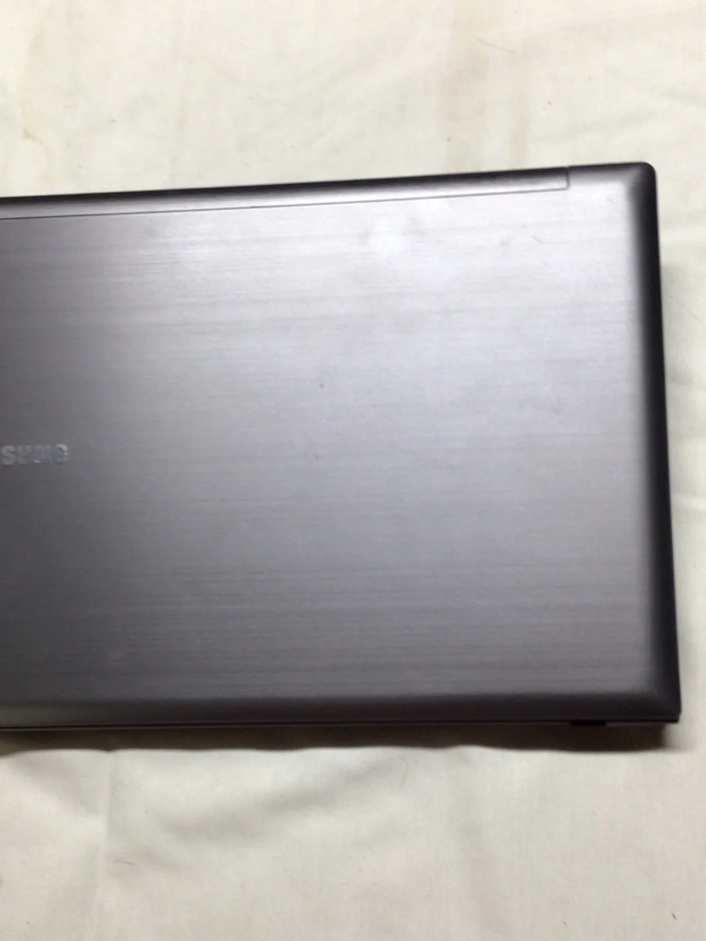 Samsung Silver and Black Laptop with Windows 7 Setup Screen